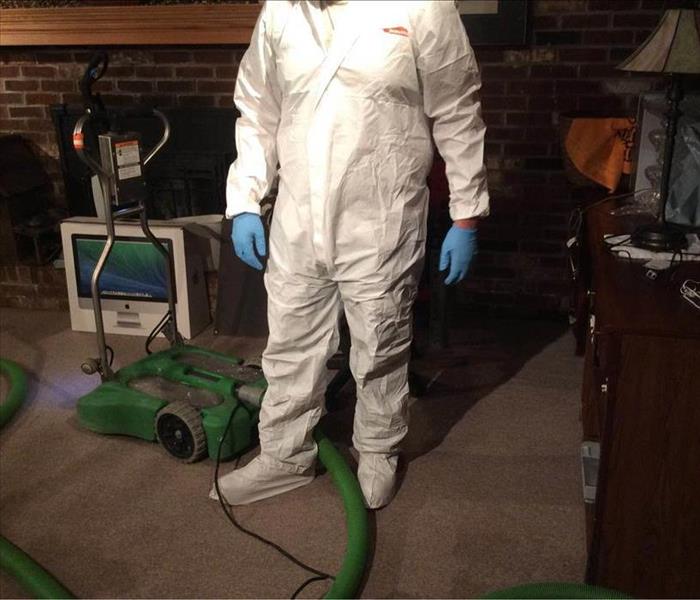 Employee suited in PPE.