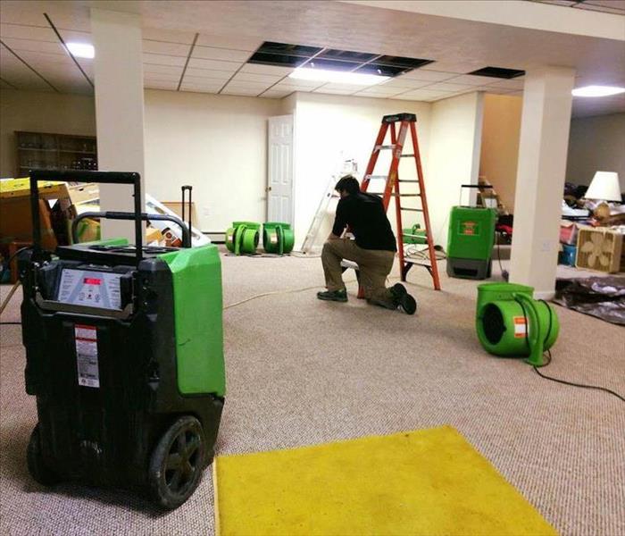 SERVPRO equipment laid out on water damaged carpet. 