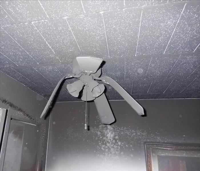 Ceiling fan melted by fire. 