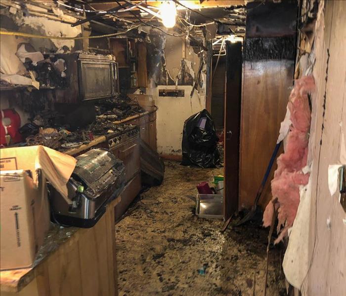 Severely fire damaged kitchen.