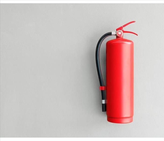 Fire extinguisher hanging on a wall